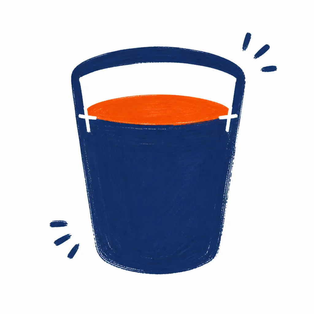 A navy bucket filled exactly to the line with orange, not overflowing