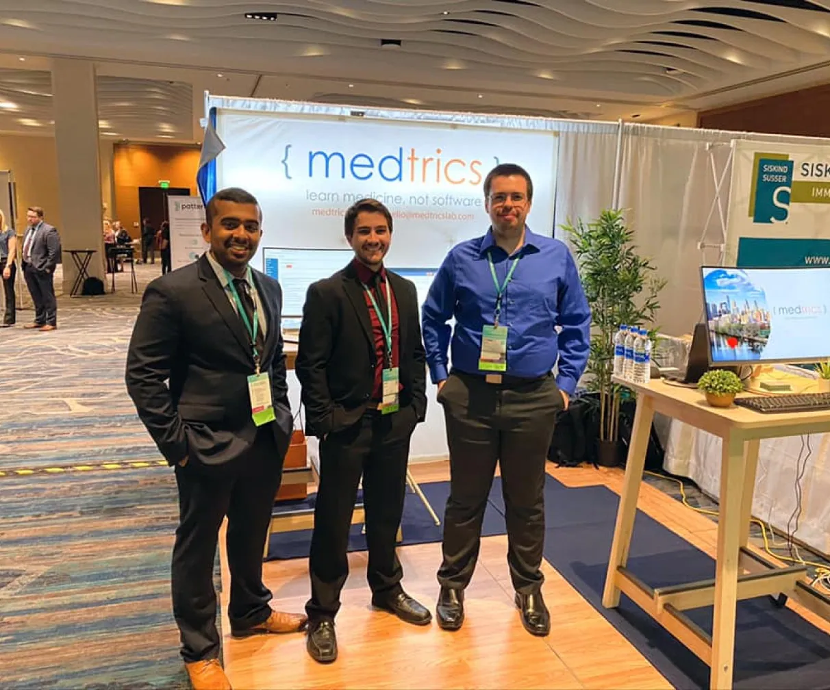 Medtrics team members collaborating and building the platform together